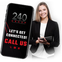 A woman holding a tablet beside a phone that says call 240 Group to get connected.